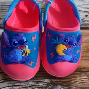 Disney Light upStitch crocs in Pink and Green